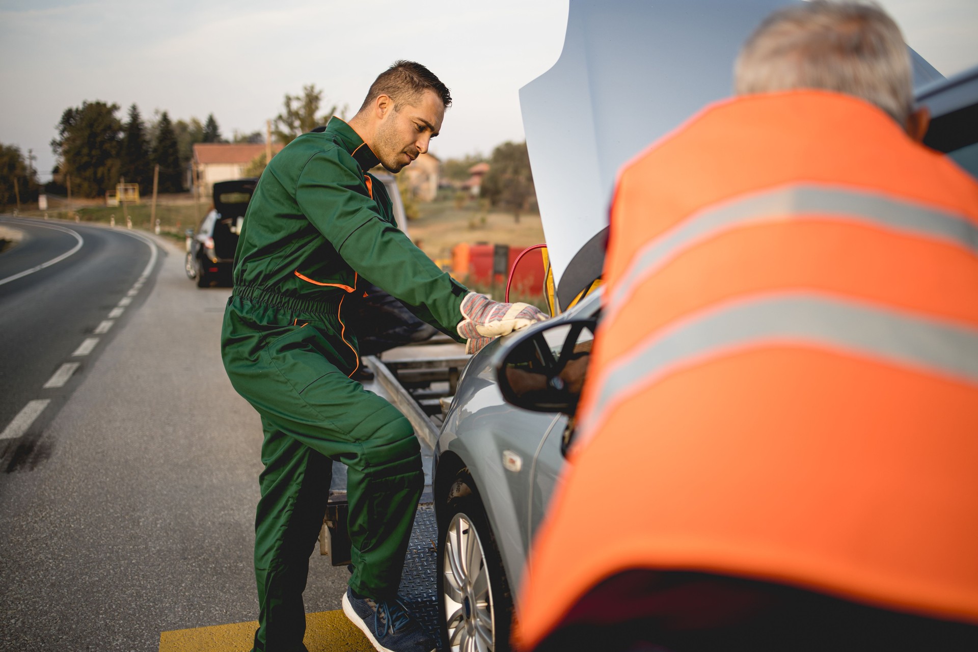 Repairer, transports a broken car on the road.Stock photo